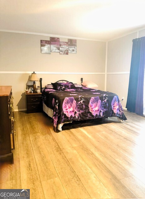 105 Dowdy Court Perry, GA 31069 - Photo 7 of 12 a bedroom with a bed and a couch