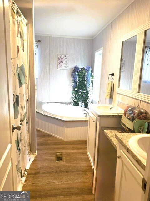 105 Dowdy Court Perry, GA 31069 - Photo 8 of 12 a bathroom with a tub sink and mirror