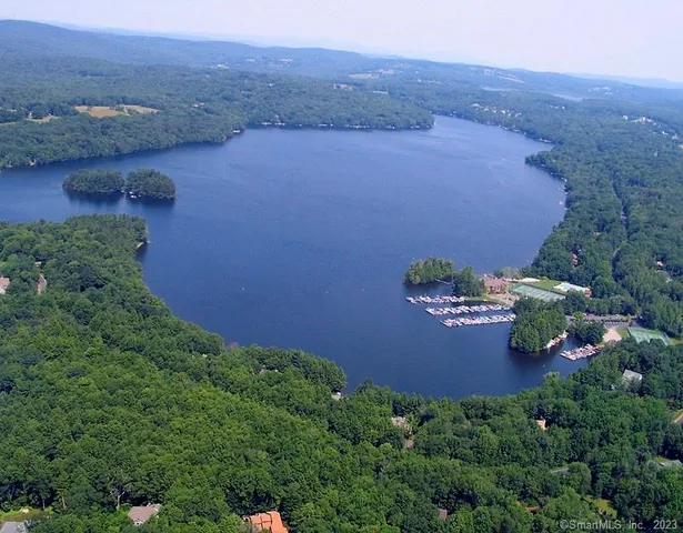 an aerial view of a house with yard