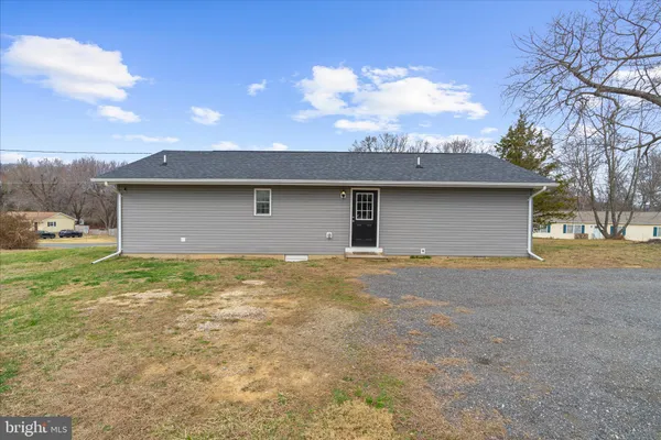 a view of a house with a yard and garage