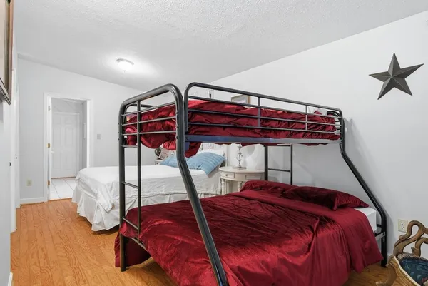 a bed room with a bed and a window