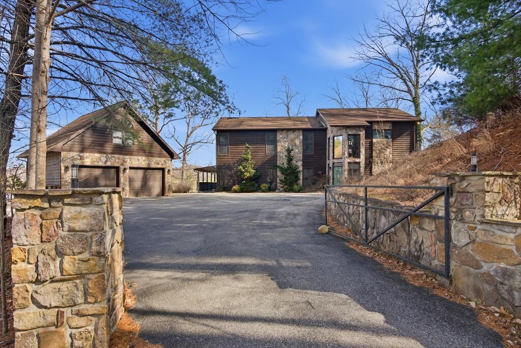 3537 Ferncliff Road Pulaski, VA 24301 - Photo 28 of 50 a view of a white house with large trees and wooden fence