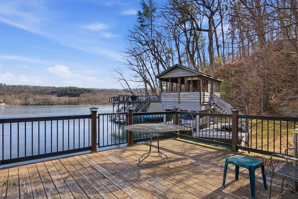 3537 Ferncliff Road Pulaski, VA 24301 - Photo 43 of 50 a view of a roof deck with table and chairs and wooden floor