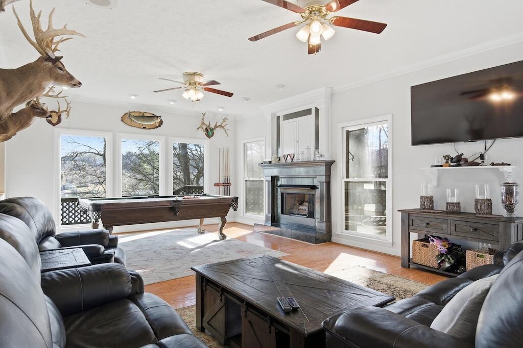 3537 Ferncliff Road Pulaski, VA 24301 - Photo 5 of 50 a living room with furniture a fireplace and a flat screen tv