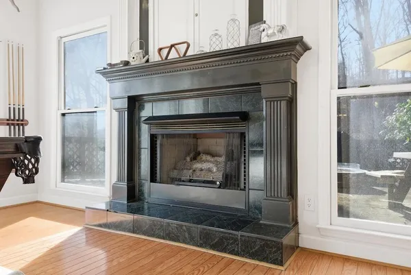 a living room with a fireplace and a fireplace