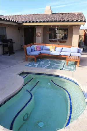swimming pool with outdoor seating