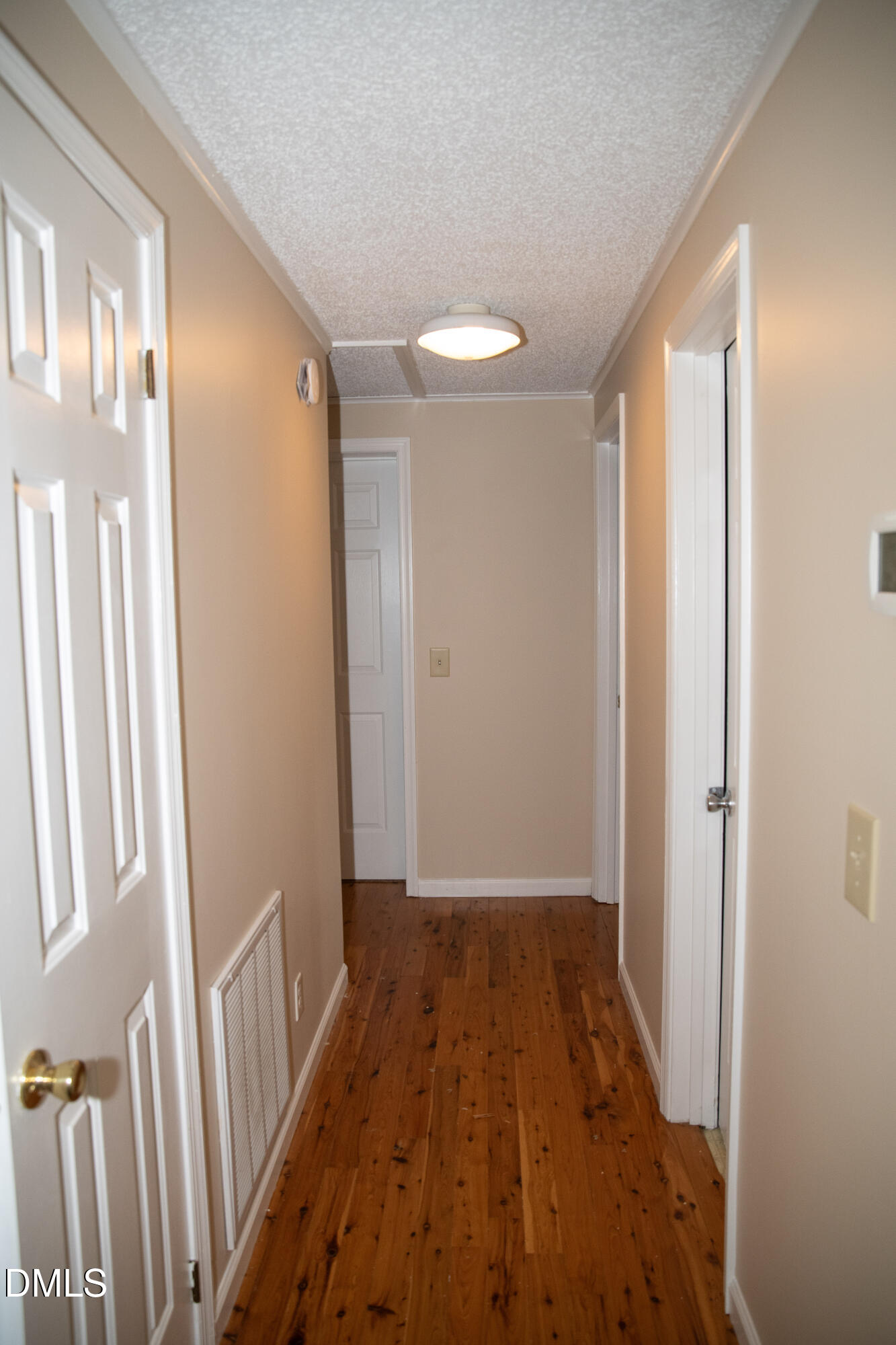 230 Hillsborough Road Timberlake, NC 27583 - Photo 14 of 15 a view of a hallway with wooden floor and staircase