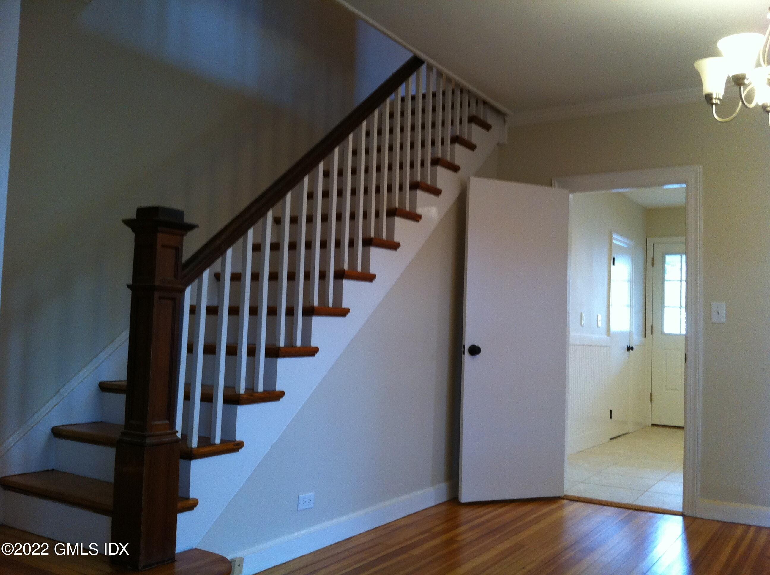 84 Pemberwick Road Greenwich, CT 06831 - Photo 5 of 12 a view of entryway with wooden floor and stairs