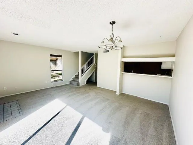 a view of a livingroom with a staircase