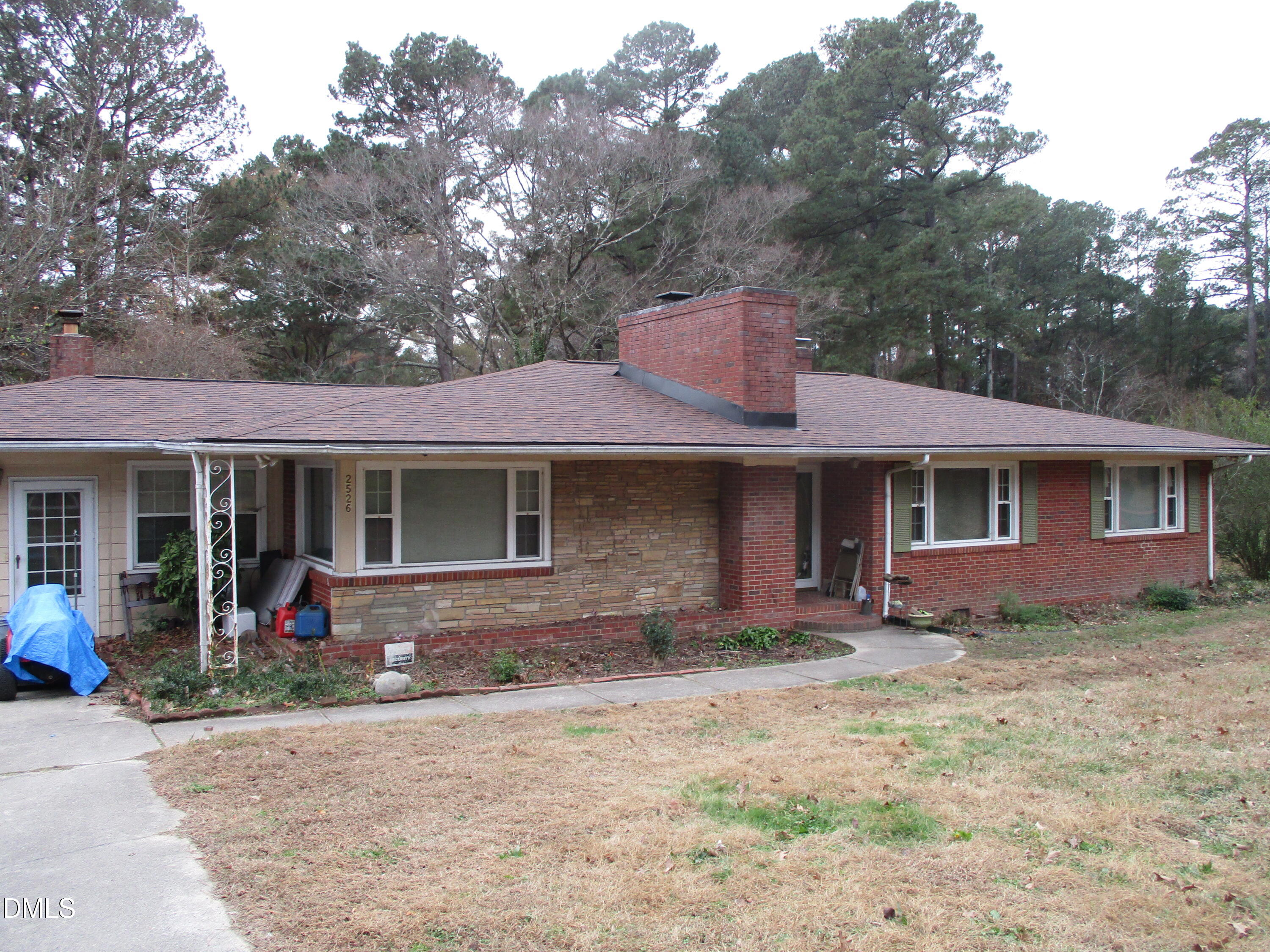 2526 Poole Road Raleigh, NC 27610 - Photo 1 of 5 a front view of a house with garden