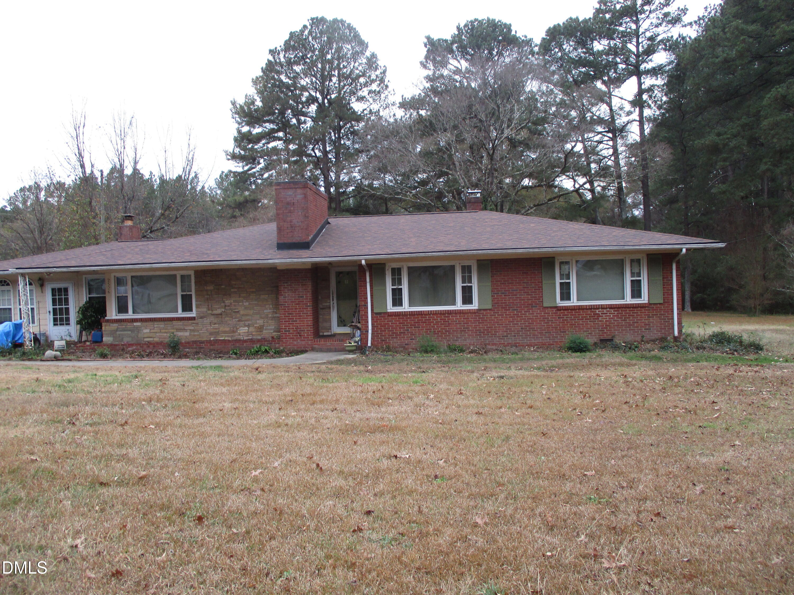 2526 Poole Road Raleigh, NC 27610 - Photo 2 of 5 a front view of a house with yard