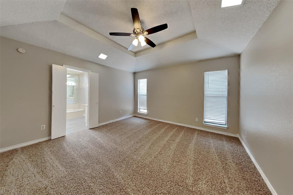 1906 Lavaca Trail Carrollton, TX 75010 - Photo 15 of 31 a view of an empty room with a ceiling fan