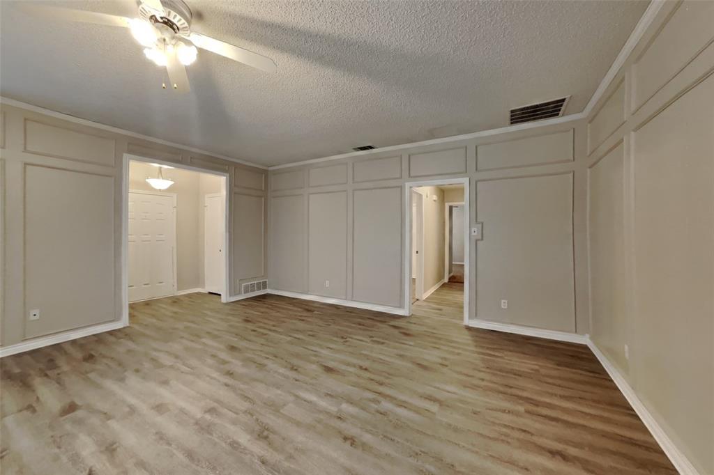 1906 Lavaca Trail Carrollton, TX 75010 - Photo 2 of 31 a view of an empty room with wooden floor