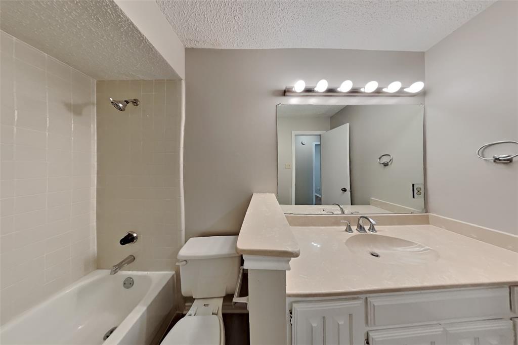 1906 Lavaca Trail Carrollton, TX 75010 - Photo 26 of 31 a bathroom with a sink and a mirror