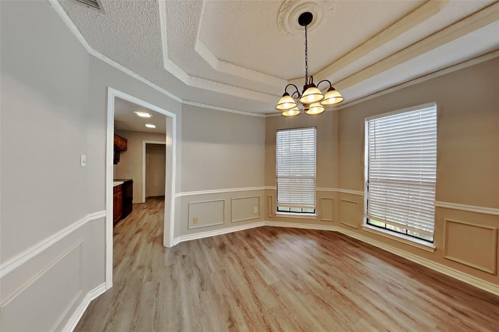 1906 Lavaca Trail Carrollton, TX 75010 - Photo 10 of 31 a view of a livingroom with wooden floor and a large window
