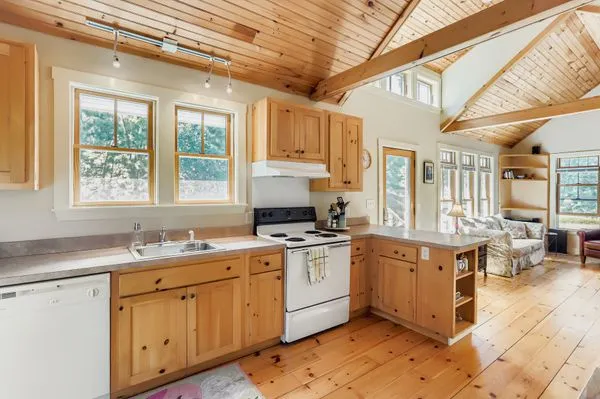 a kitchen that has a cabinets counter space and a stove