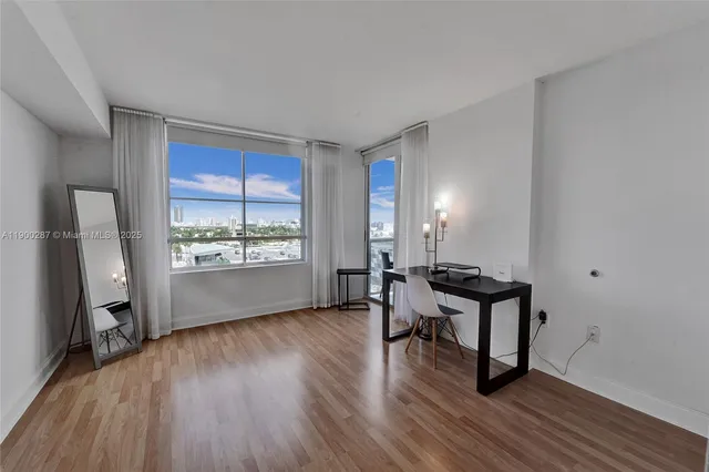 a workspace with furniture window and wooden floor