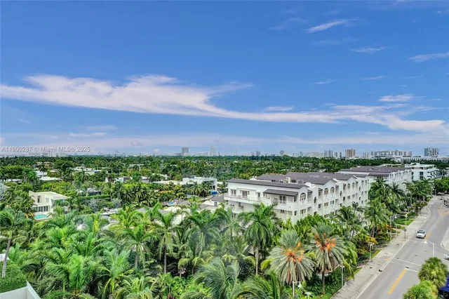 a view of a city with lush green forest