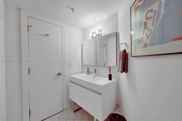 a bathroom with a sink and mirror