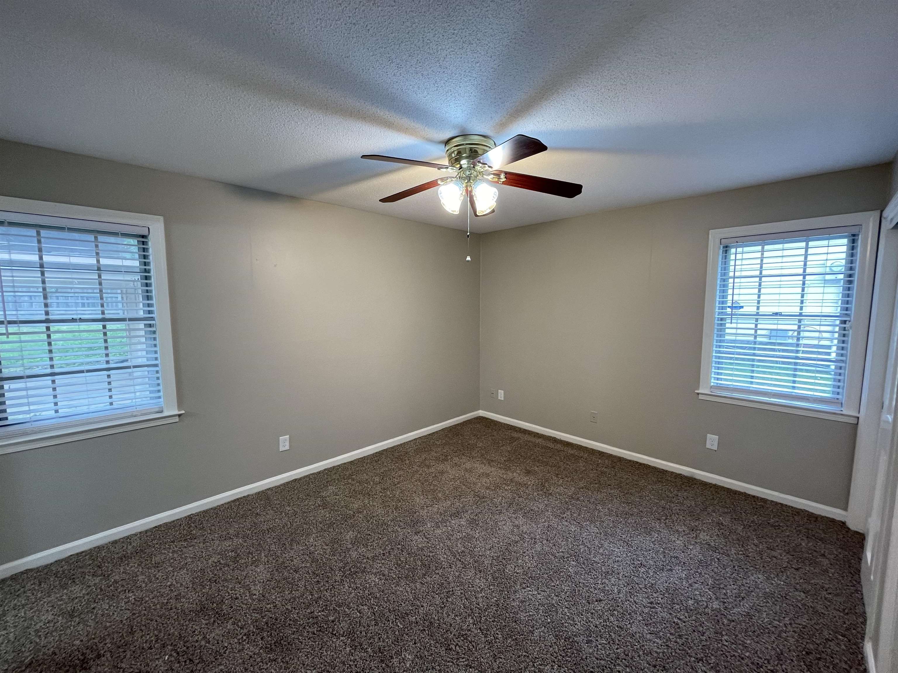 5414 Maple Ridge Road Memphis, TN 38134 - Photo 16 of 23 Unfurnished room with a textured ceiling, carpet, and ceiling fan