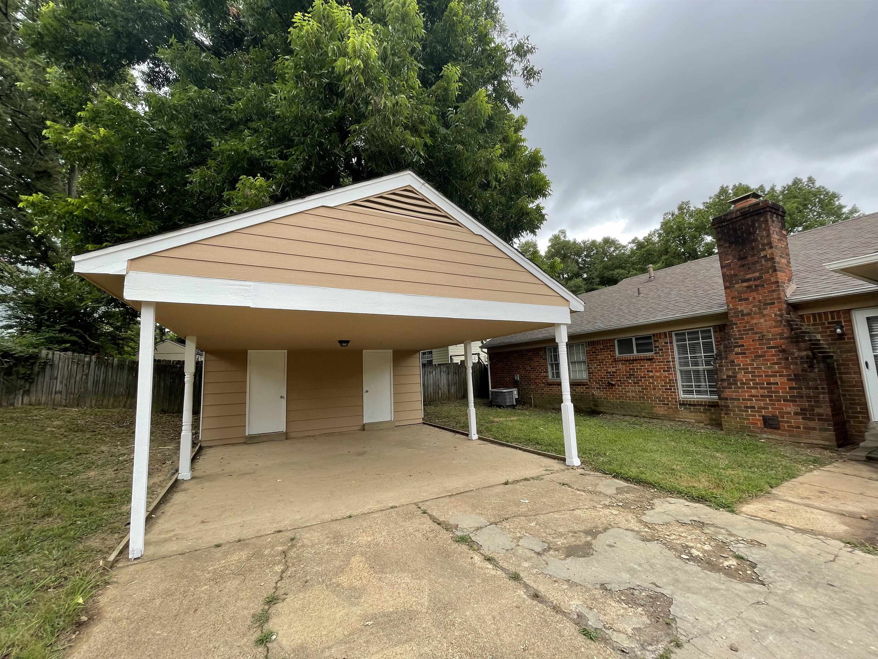 5414 Maple Ridge Road Memphis, TN 38134 - Photo 4 of 23 Backyard featuring a carport