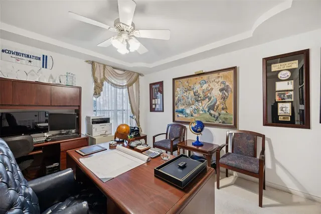 a bathroom with a sink mirror and a toilet