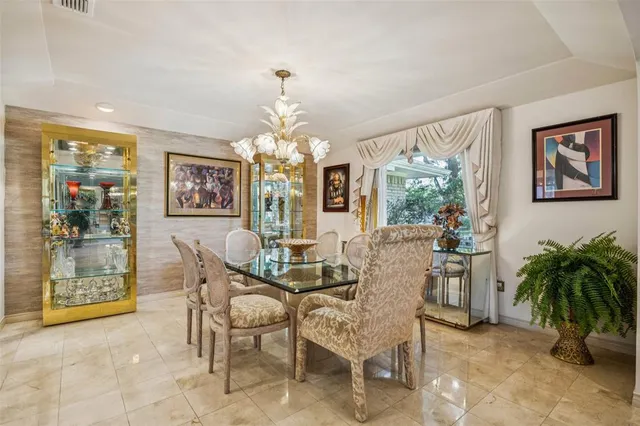 a living room with furniture and a lamp