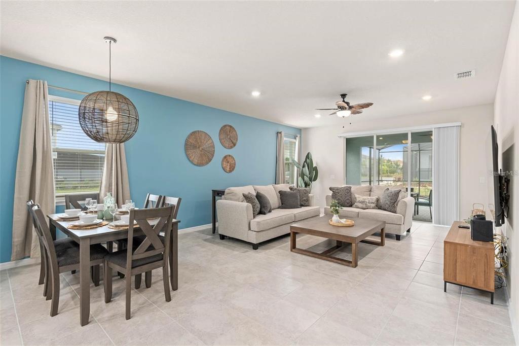7180 Oakmoss Loop Davenport, FL 33837 - Photo 13 of 29 a living room with furniture and a large window