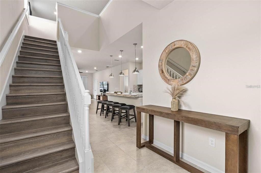 7180 Oakmoss Loop Davenport, FL 33837 - Photo 7 of 29 a view of entryway and hall with wooden floor