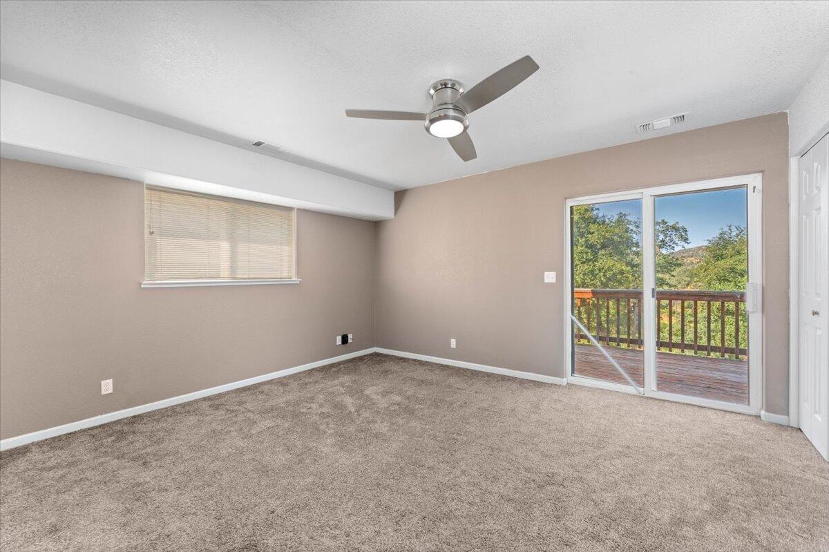 8550 Muletown Road Redding, CA 96001 - Photo 11 of 37 a view of an empty room with a window