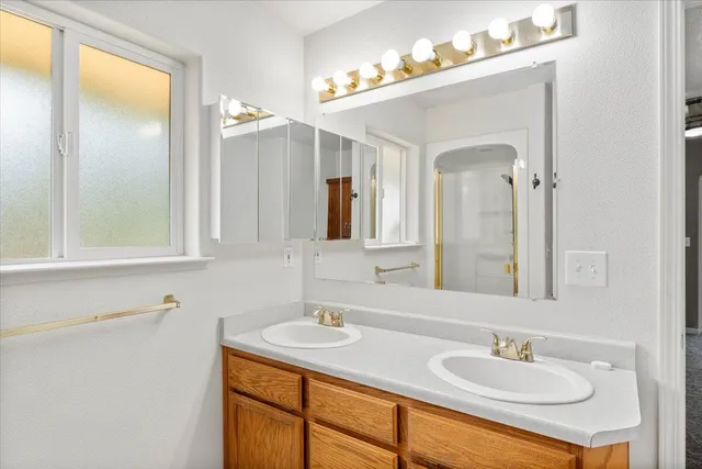 a bathroom with a toilet and a mirror