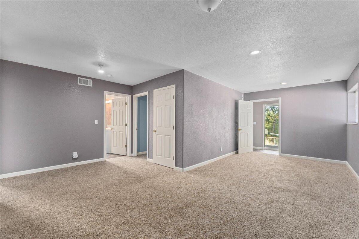 8550 Muletown Road Redding, CA 96001 - Photo 14 of 37 a view of an empty room with window and closet area