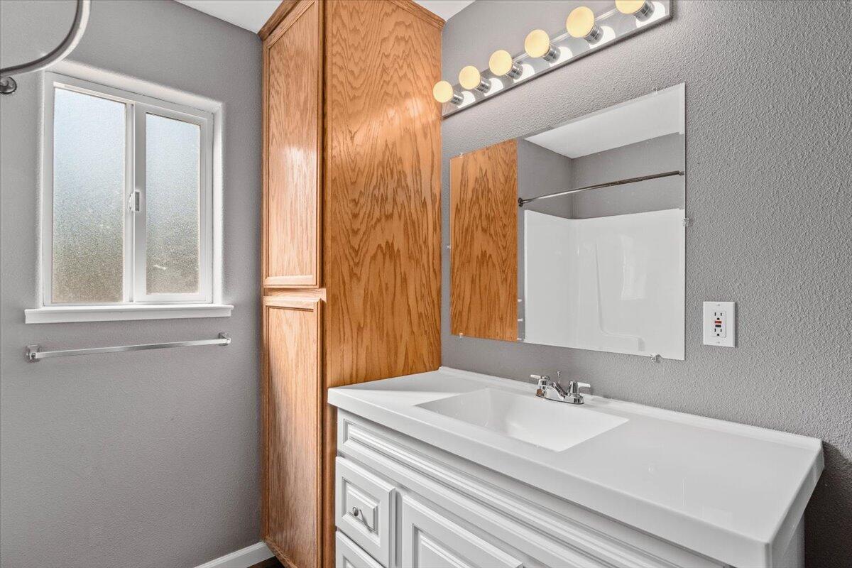 8550 Muletown Road Redding, CA 96001 - Photo 15 of 37 a bathroom with a sink and a mirror