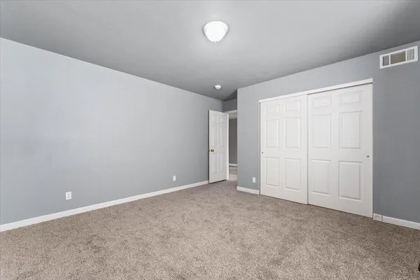 a room with a wooden floor and a chair