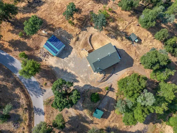 an aerial view of house with yard