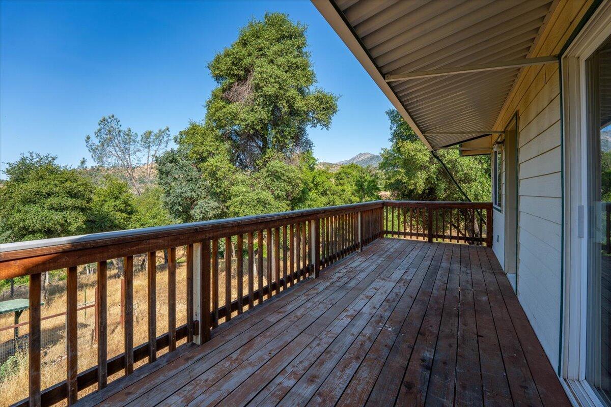 8550 Muletown Road Redding, CA 96001 - Photo 21 of 37 a balcony with wooden floor and outdoor space
