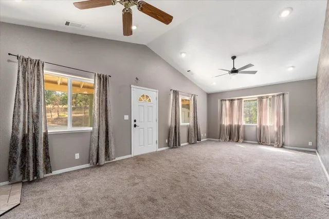 a view of an empty room with windows