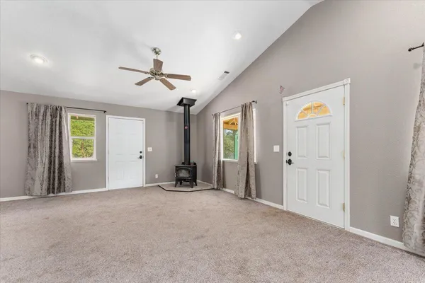 a view of an empty room with a window