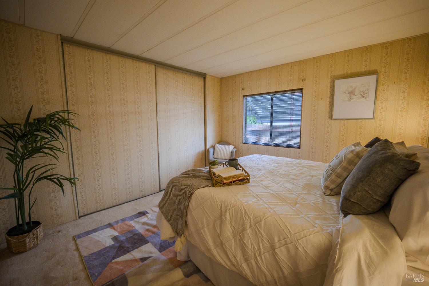 14 Balboa Court Fairfield, CA 94533 - Photo 13 of 27 a bedroom with a bed and a dresser next to a window