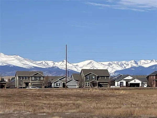 a kitchen with granite countertop a sink a stove and cabinets