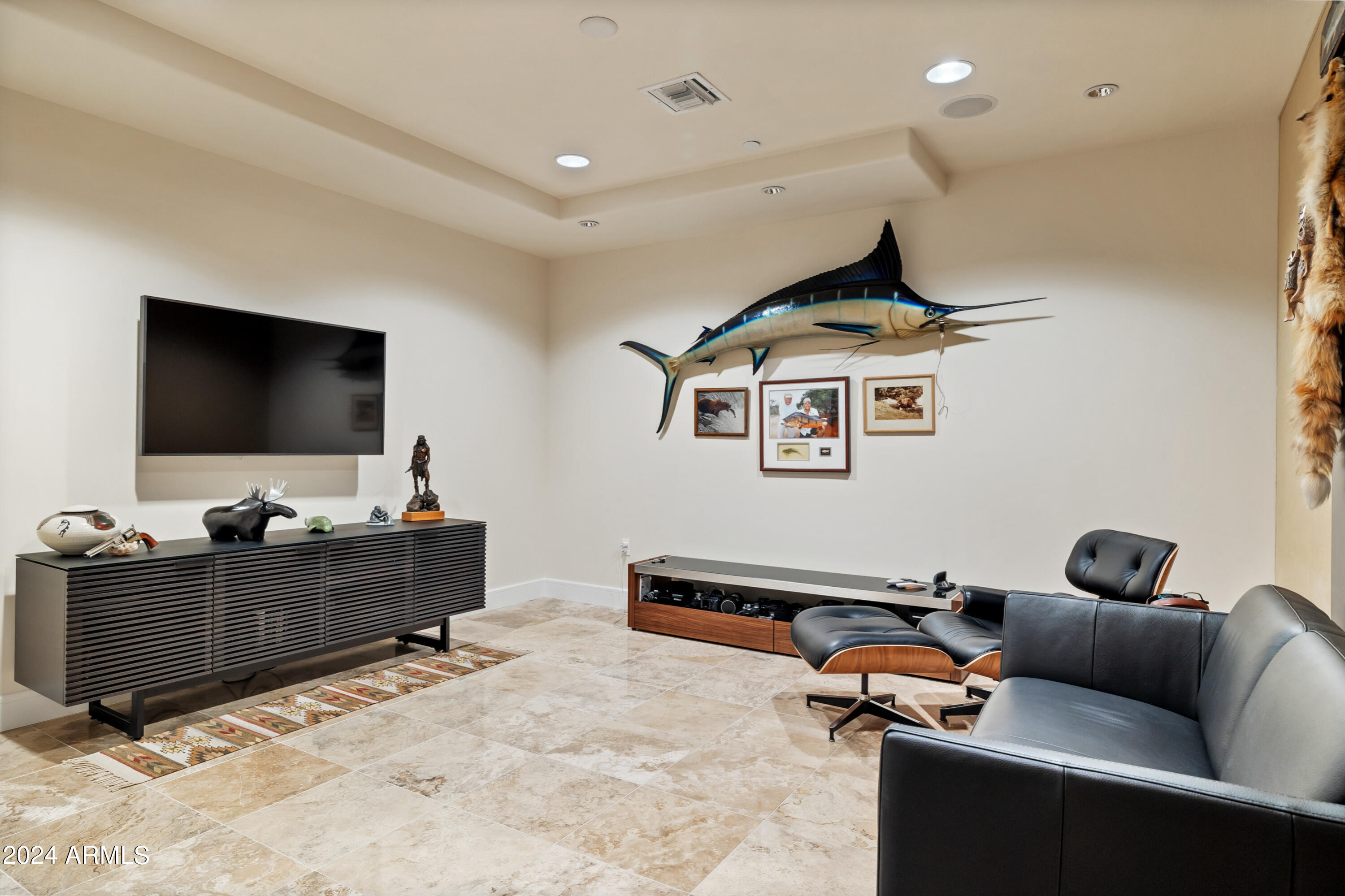 2211 East Camelback Road, Unit 407 Phoenix, AZ 85016 - Photo 14 of 36 a living room with furniture and a flat screen tv