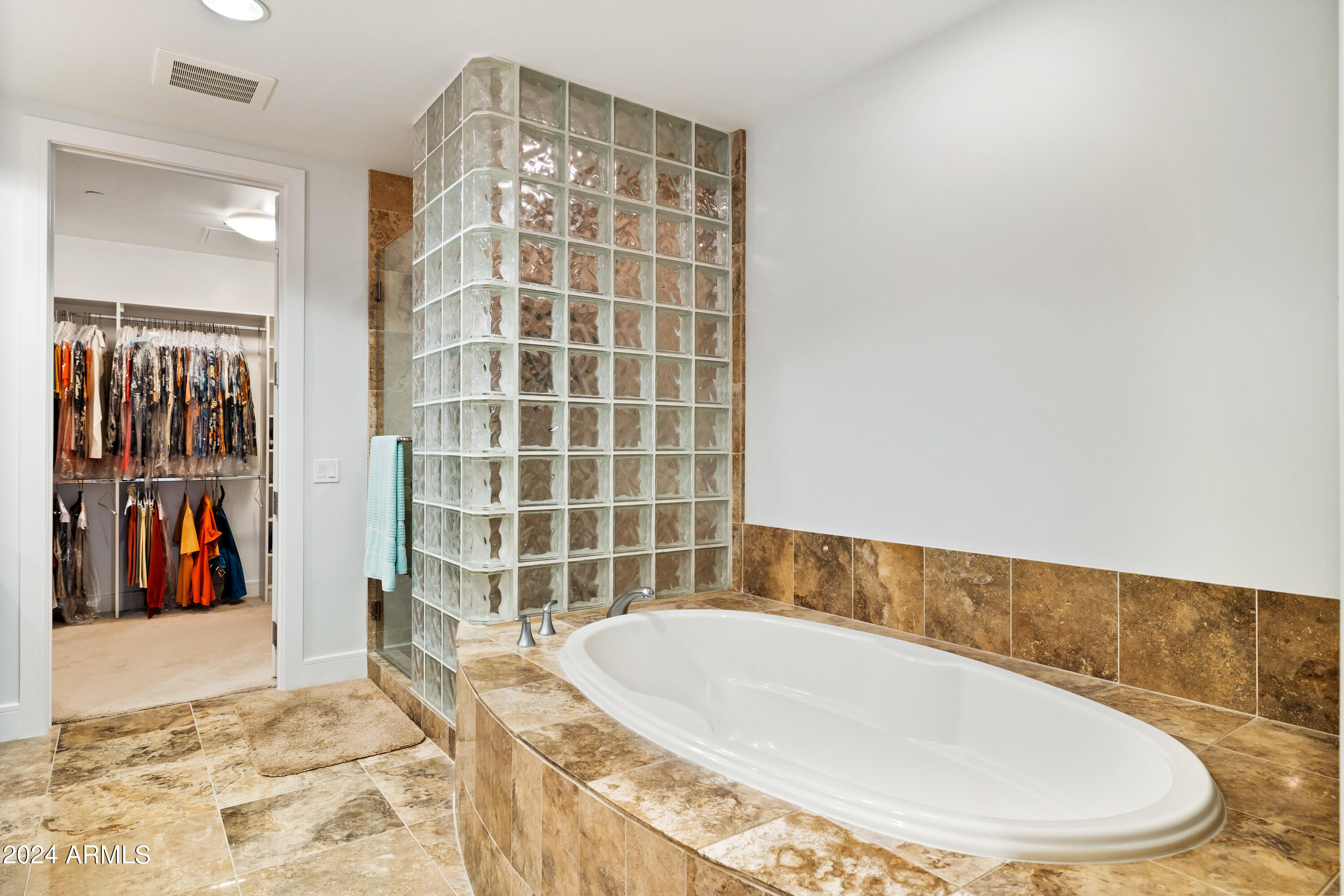 2211 East Camelback Road, Unit 407 Phoenix, AZ 85016 - Photo 15 of 36 a bathroom with a bathtub and a shower