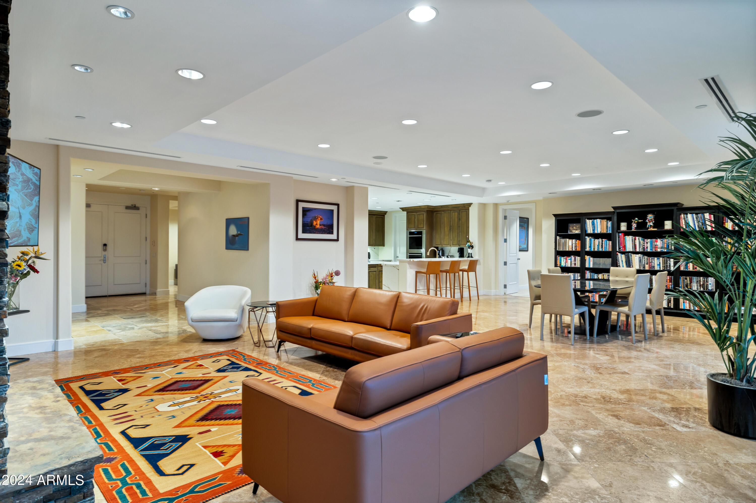 2211 East Camelback Road, Unit 407 Phoenix, AZ 85016 - Photo 18 of 36 a living room with furniture and view of kitchen