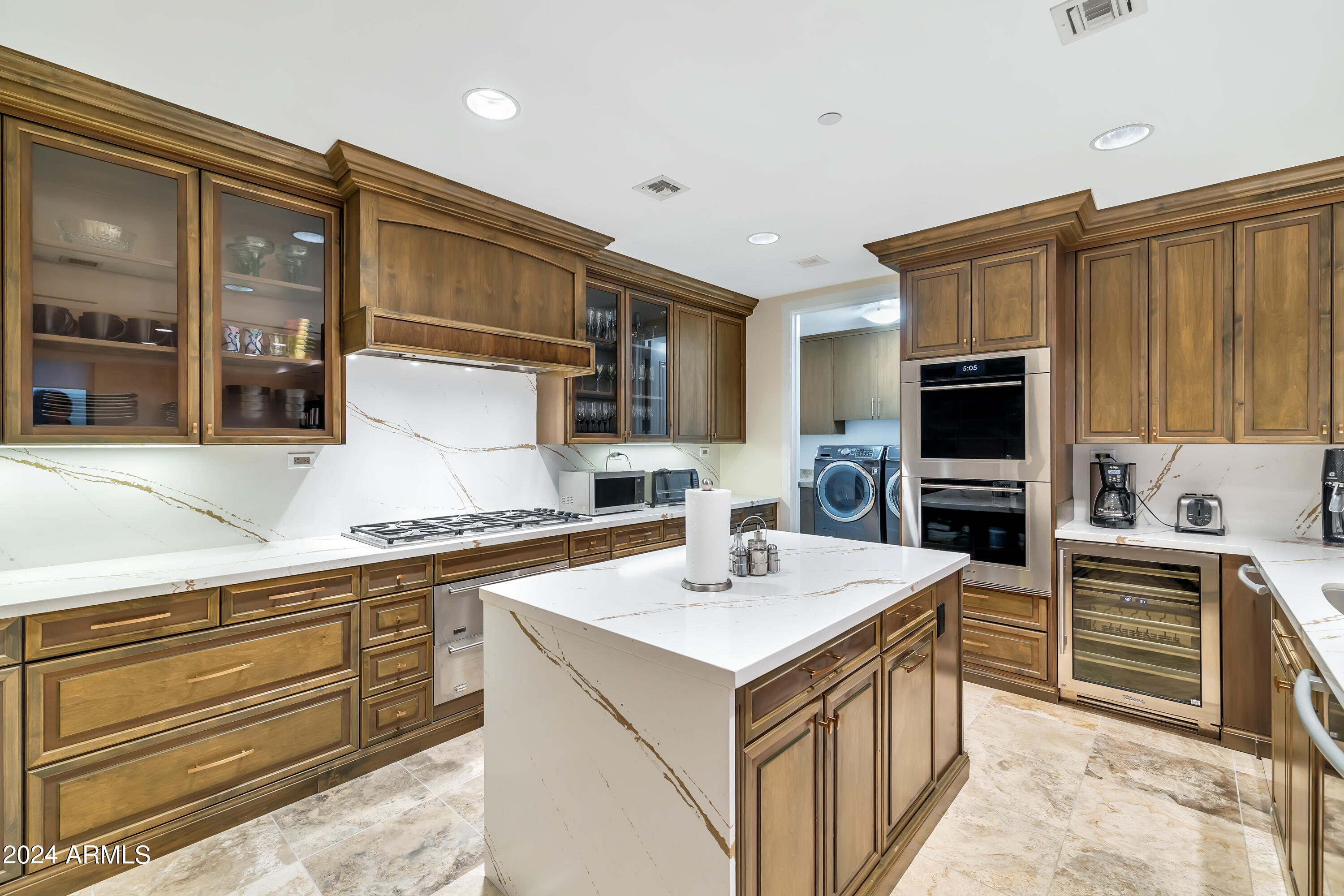 2211 East Camelback Road, Unit 407 Phoenix, AZ 85016 - Photo 21 of 36 a kitchen with stainless steel appliances a sink stove and refrigerator