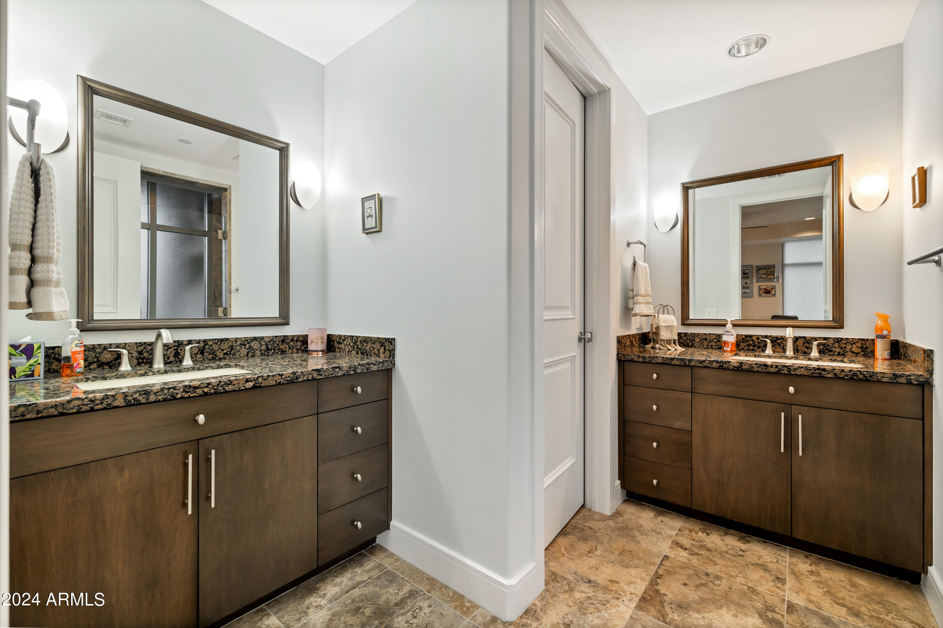 2211 East Camelback Road, Unit 407 Phoenix, AZ 85016 - Photo 22 of 36 a bathroom with a double vanity sink and a mirror