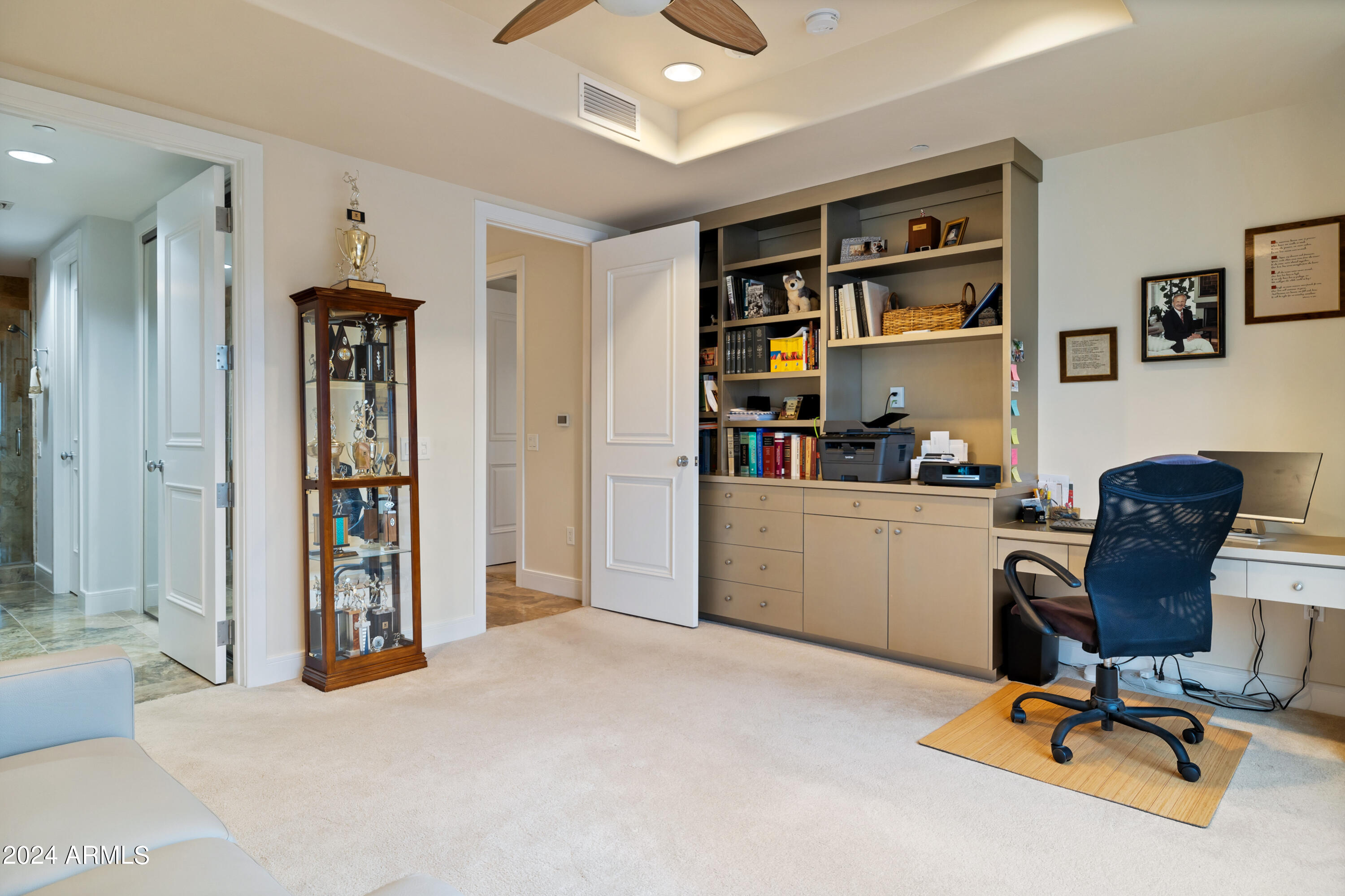 2211 East Camelback Road, Unit 407 Phoenix, AZ 85016 - Photo 23 of 36 a view of a workspace with furniture and closet