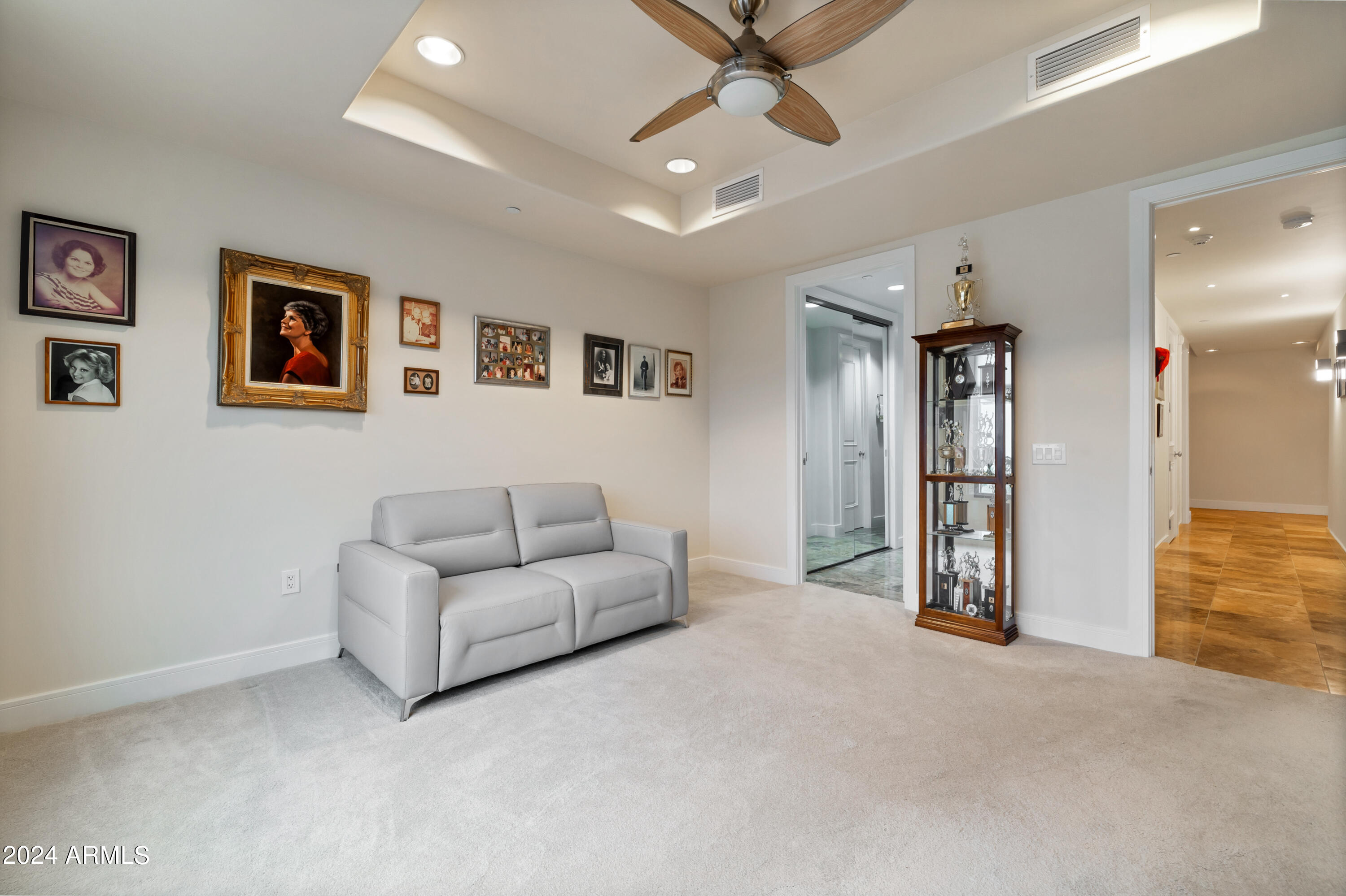 2211 East Camelback Road, Unit 407 Phoenix, AZ 85016 - Photo 25 of 36 a living room with furniture and a view of kitchen