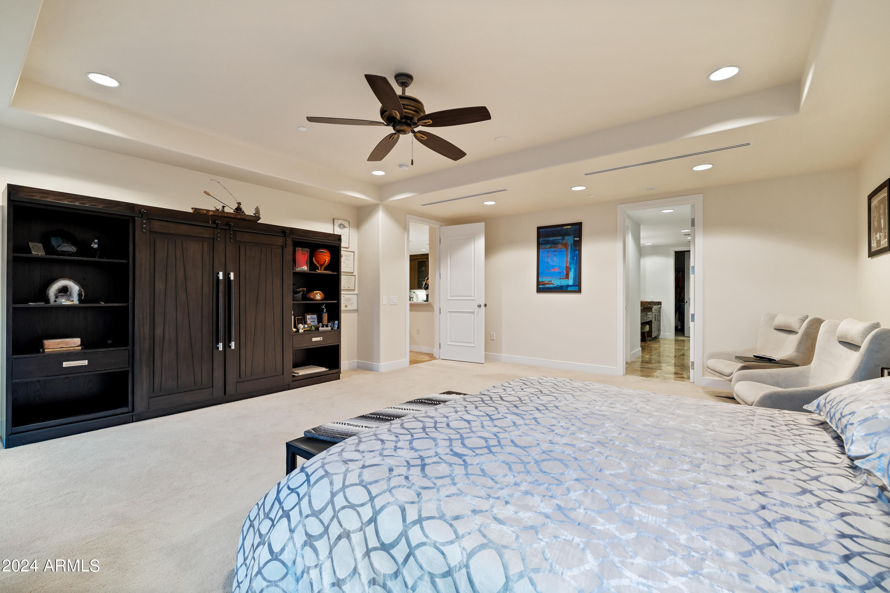 2211 East Camelback Road, Unit 407 Phoenix, AZ 85016 - Photo 28 of 36 a bedroom with a bed and a large closet