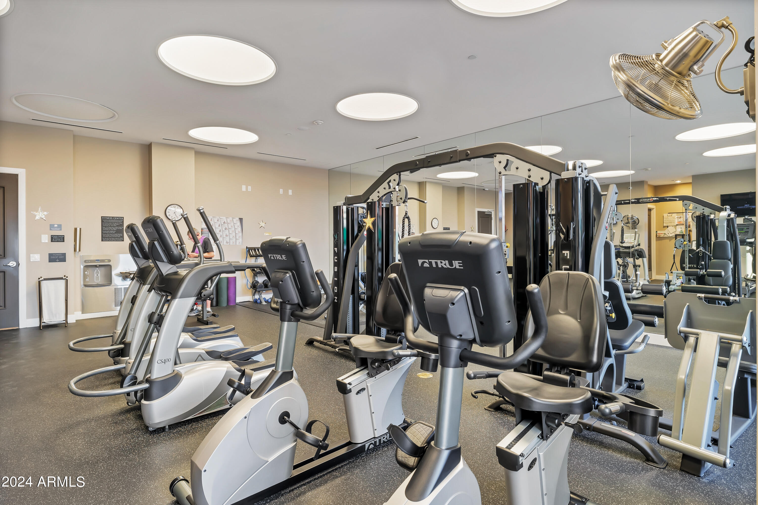 2211 East Camelback Road, Unit 407 Phoenix, AZ 85016 - Photo 31 of 36 a view of a room with gym equipment