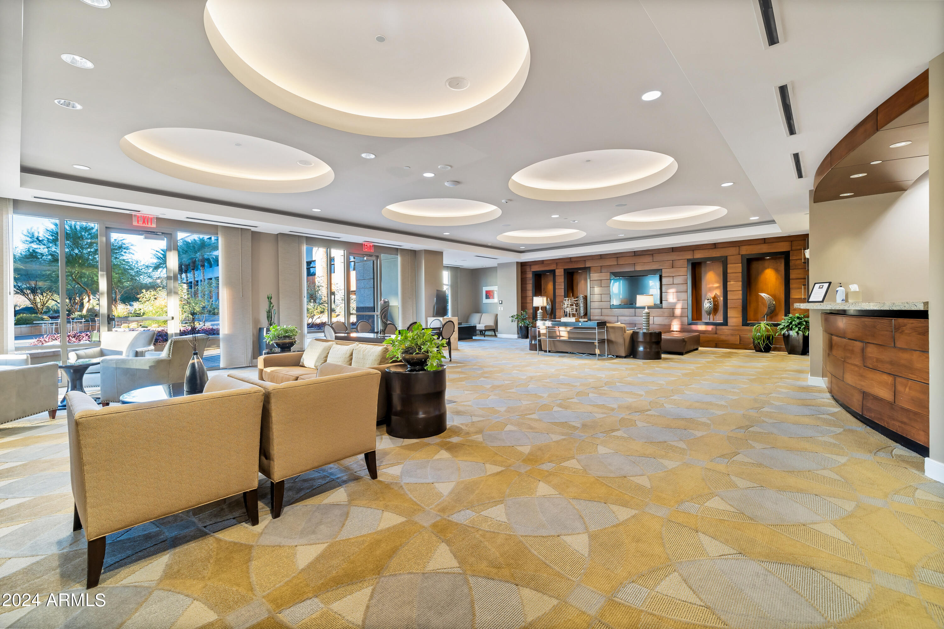 2211 East Camelback Road, Unit 407 Phoenix, AZ 85016 - Photo 33 of 36 a living room with furniture and a dining table